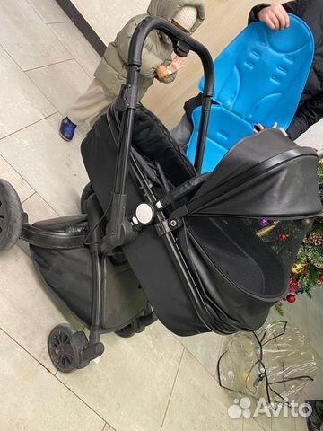 Коляска чёрная из экокожи 2 в 1